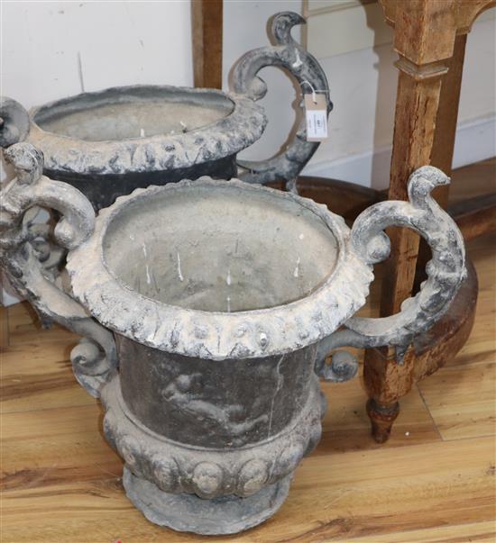A pair of lead garden urns, with acanthus leaf scroll handles W.60cm approx.